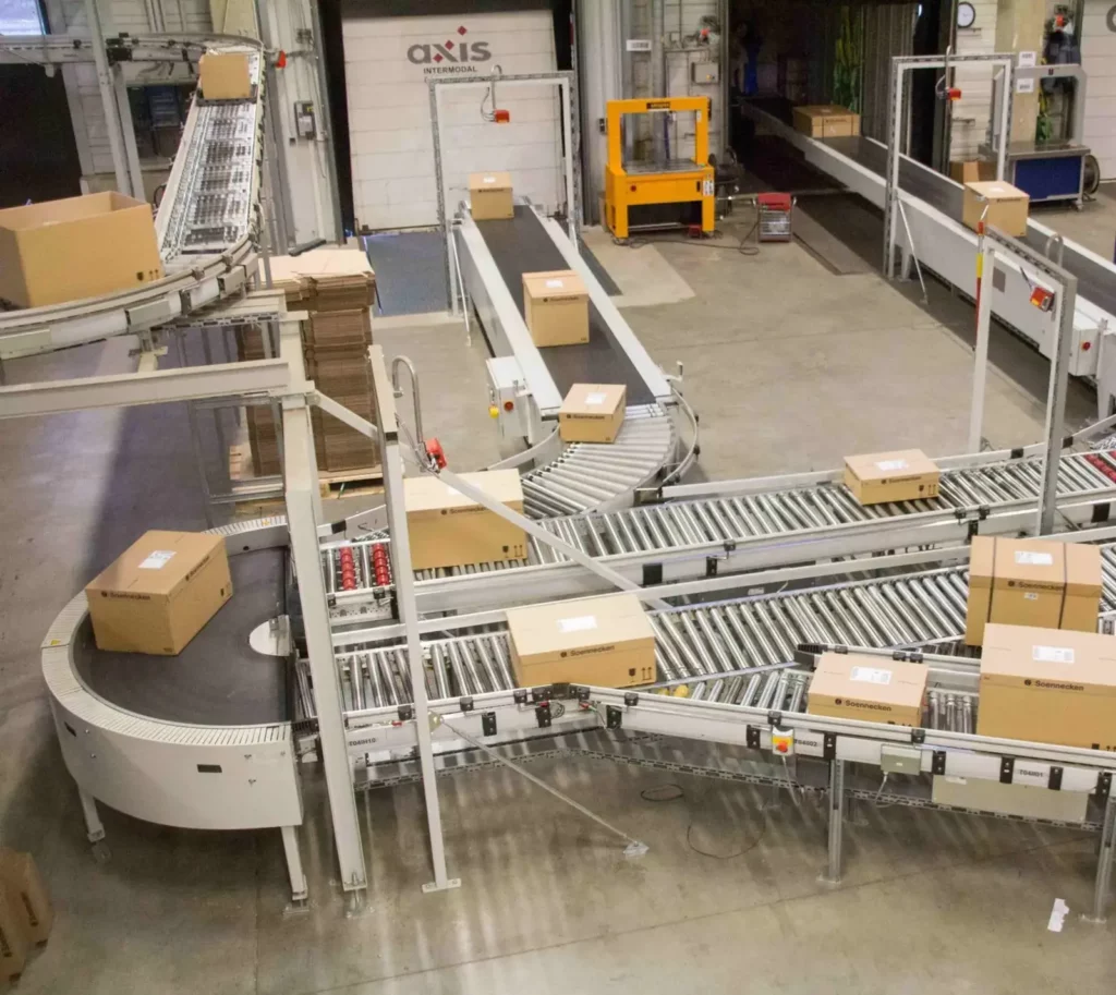 Export cartons moving through a warehouse conveyor before dispatch