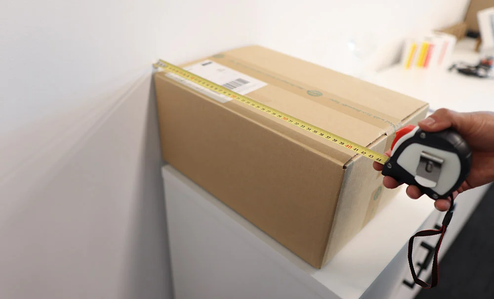 Measuring parcel dimensions before calculating final shipping cost