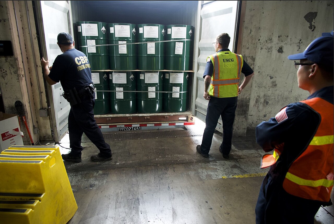 Inspection team checking a shipping container at a port