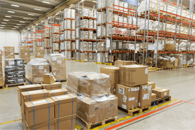 Warehouse storage area holding multiple seller parcels before package consolidation