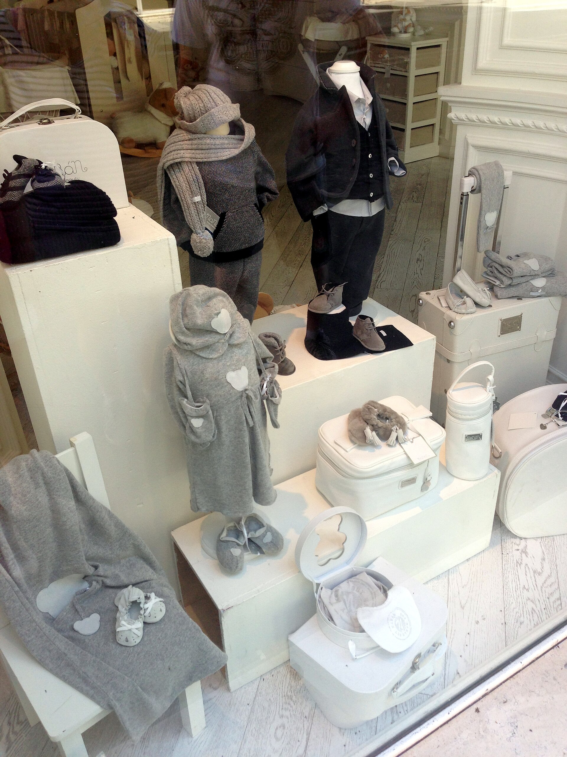 Baby clothes on display inside a store