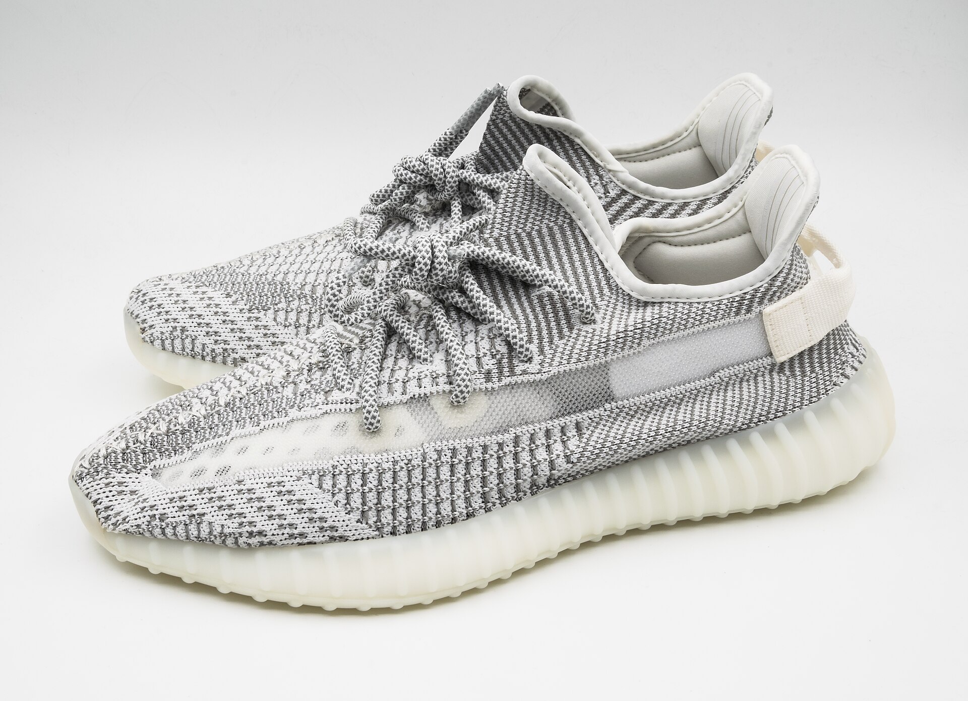 Sneaker pair reviewed before export approval