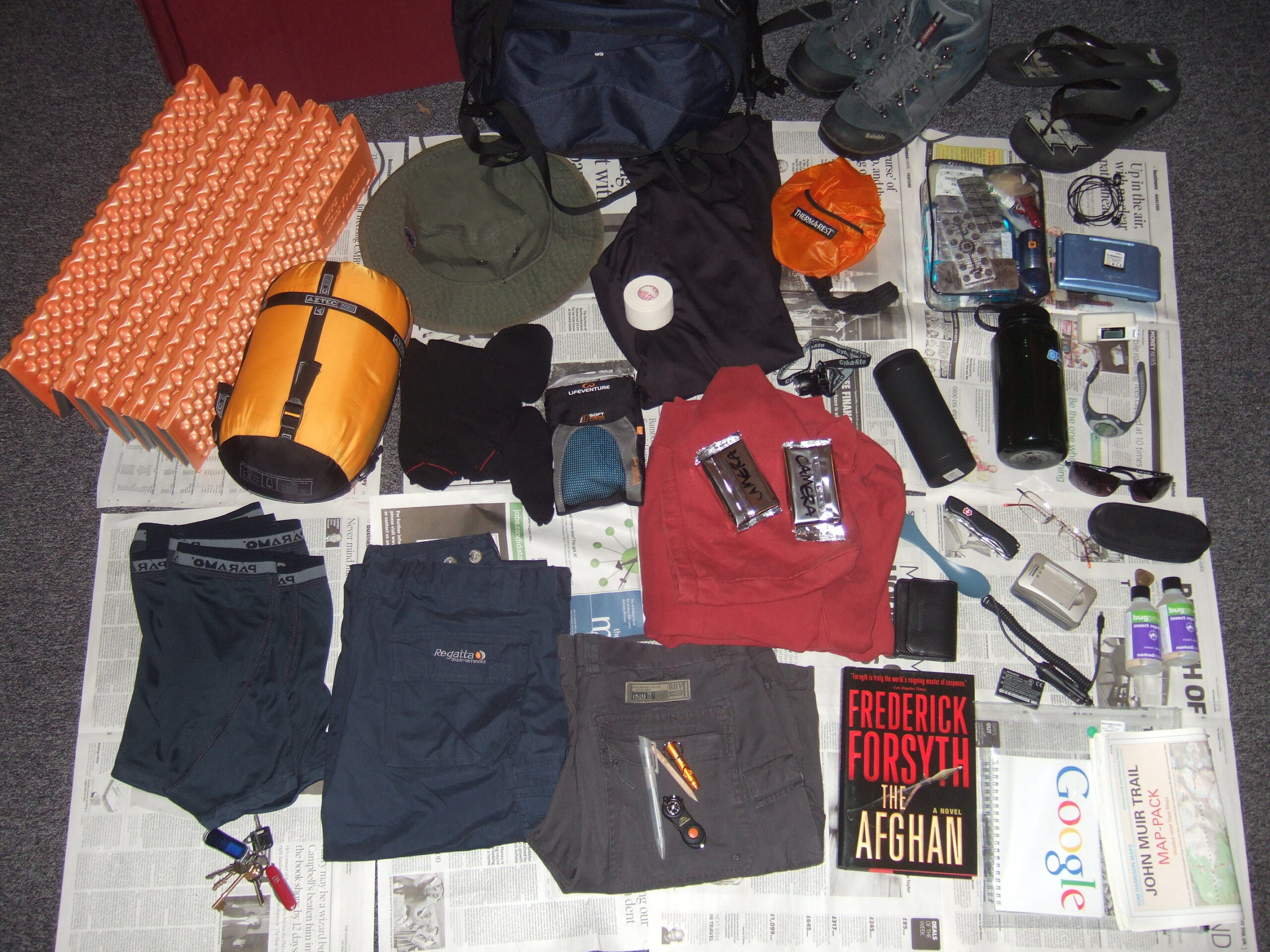 Camping equipment arranged outdoors before packing