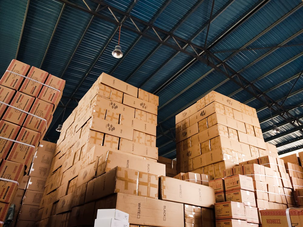 Stacked small parcels in a warehouse waiting for standard shipping