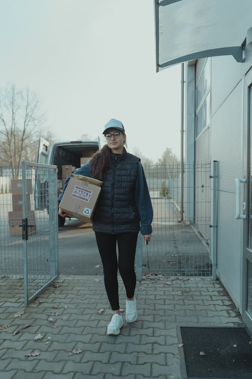 Courier carrying a parcel for faster international delivery
