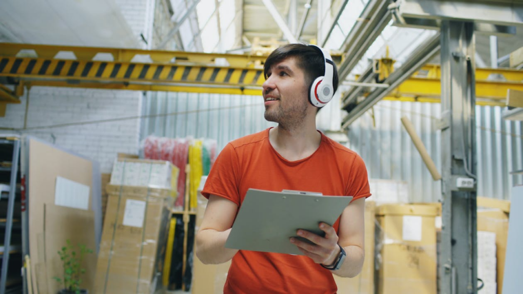 Warehouse worker checking parcels for priority shipping