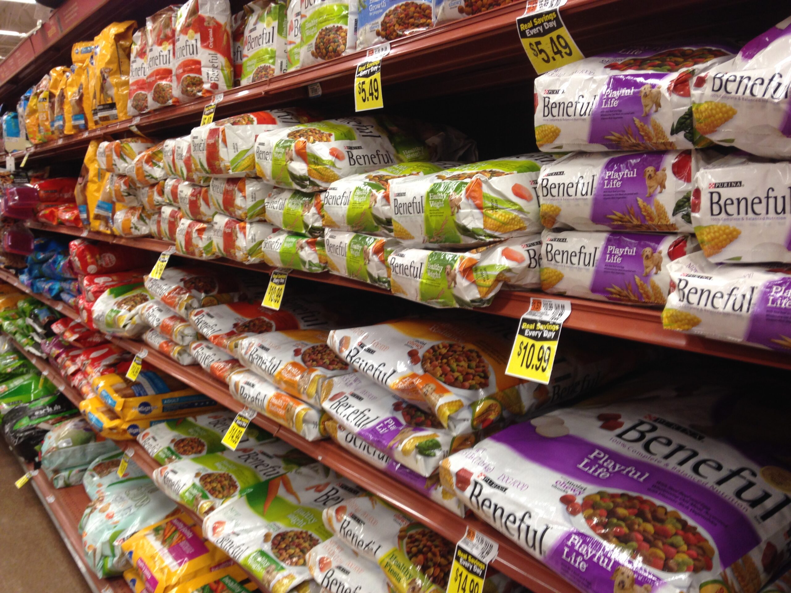 Dog food aisle showing bulky packaging and product variety