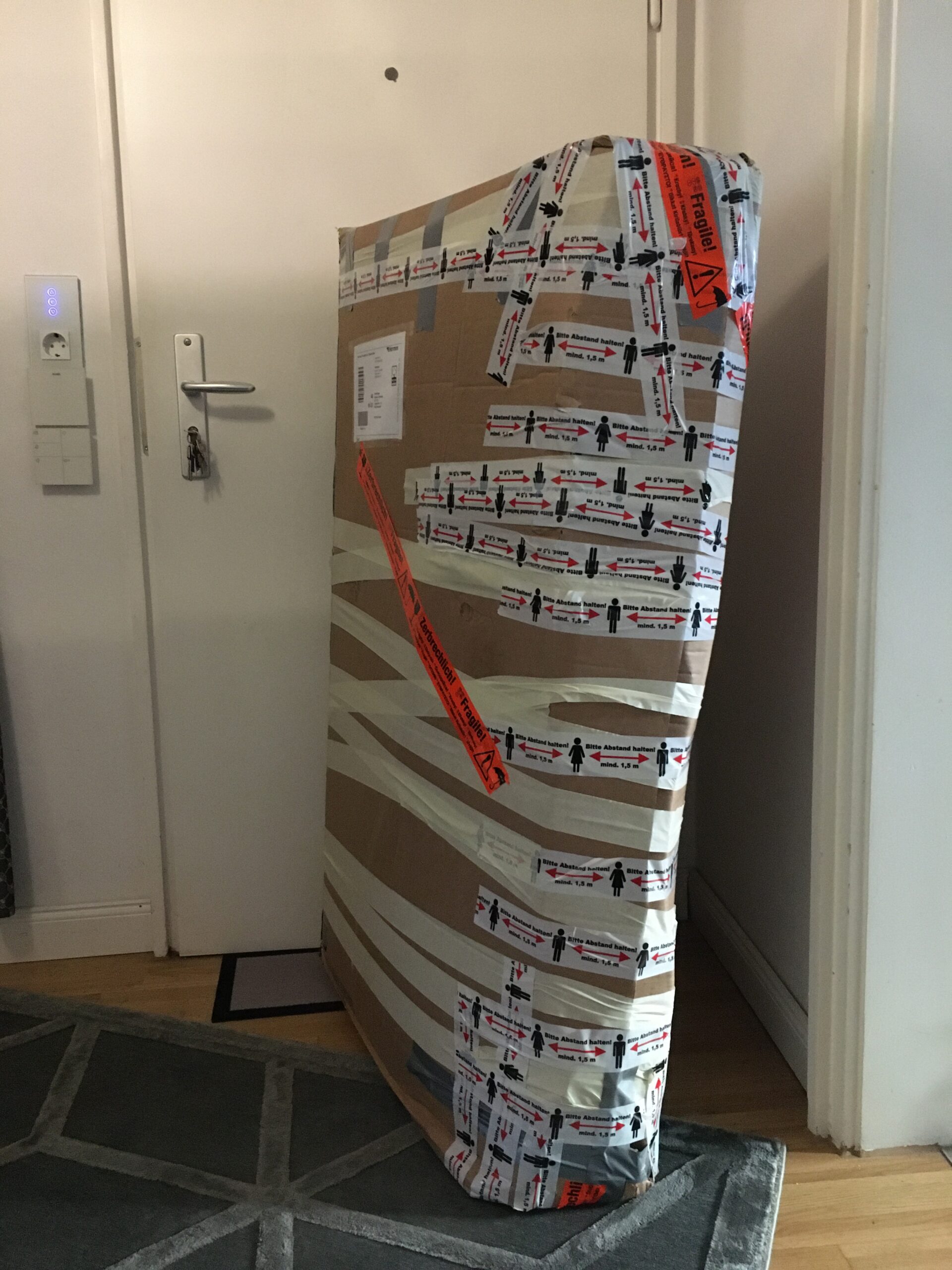 Large fragile item secured inside a custom shipping box for parcel service