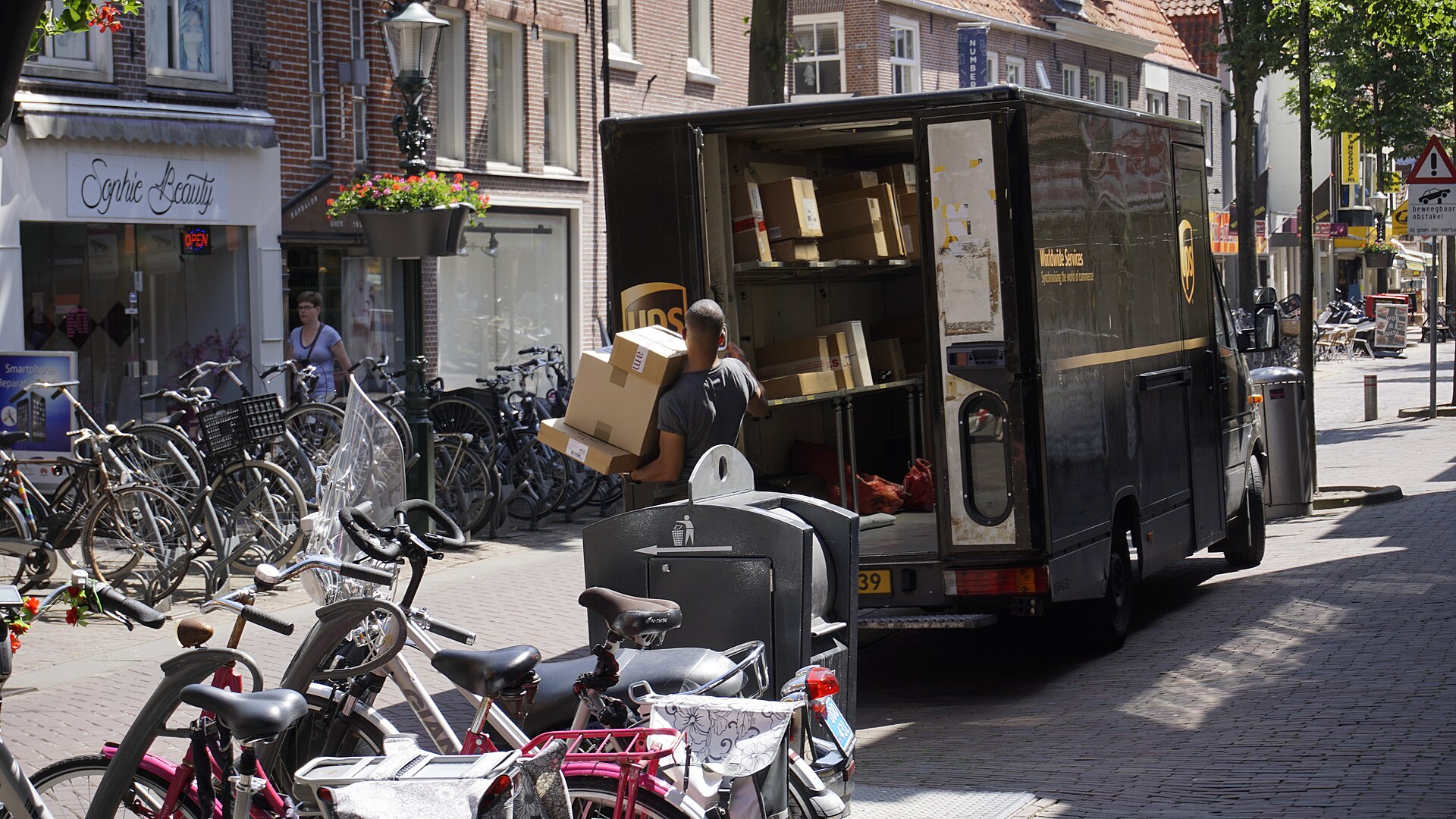 Courier van handling parcel delivery on the last-mile route