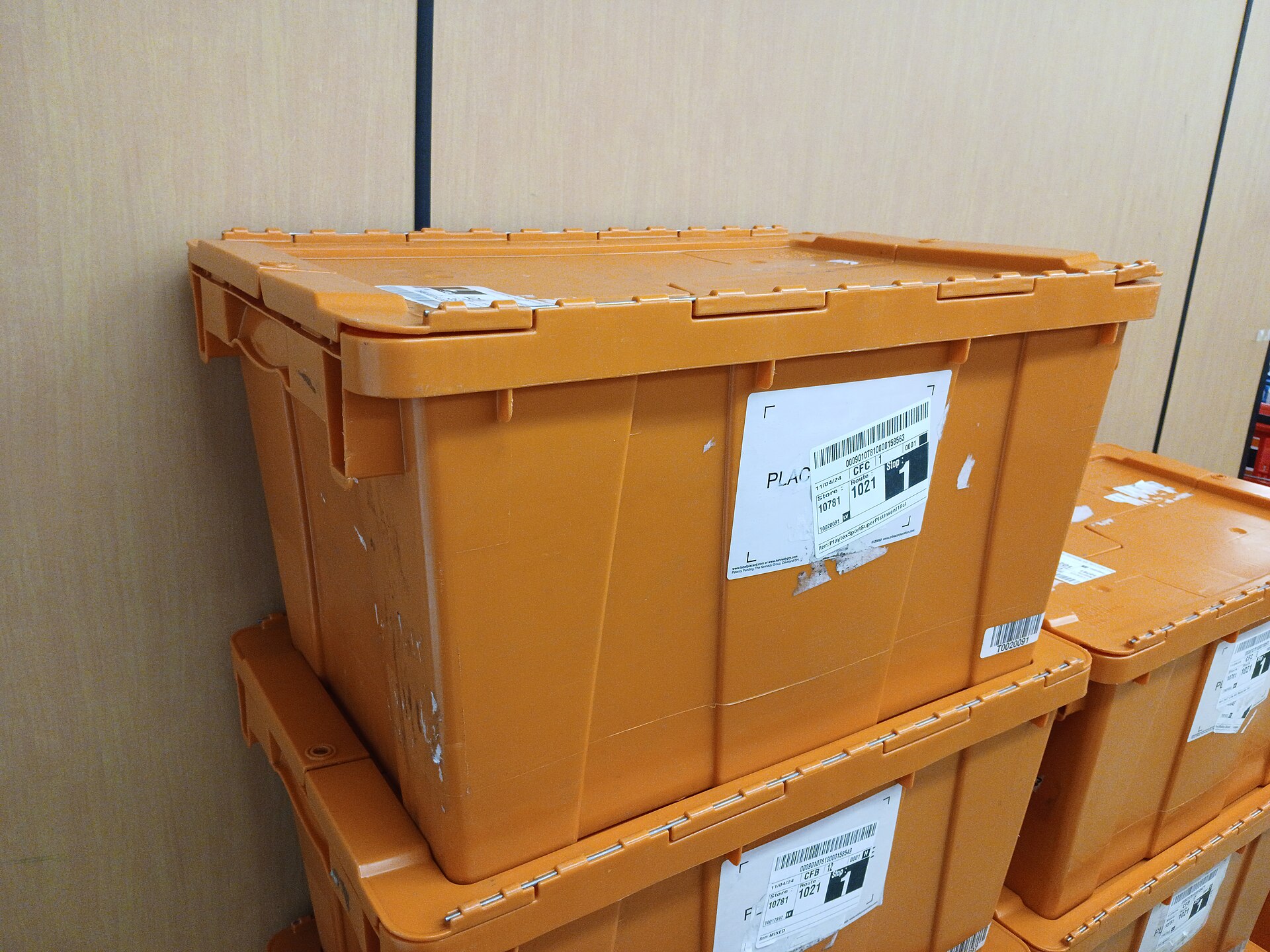 Warehouse totes used while checking parcel count and labels