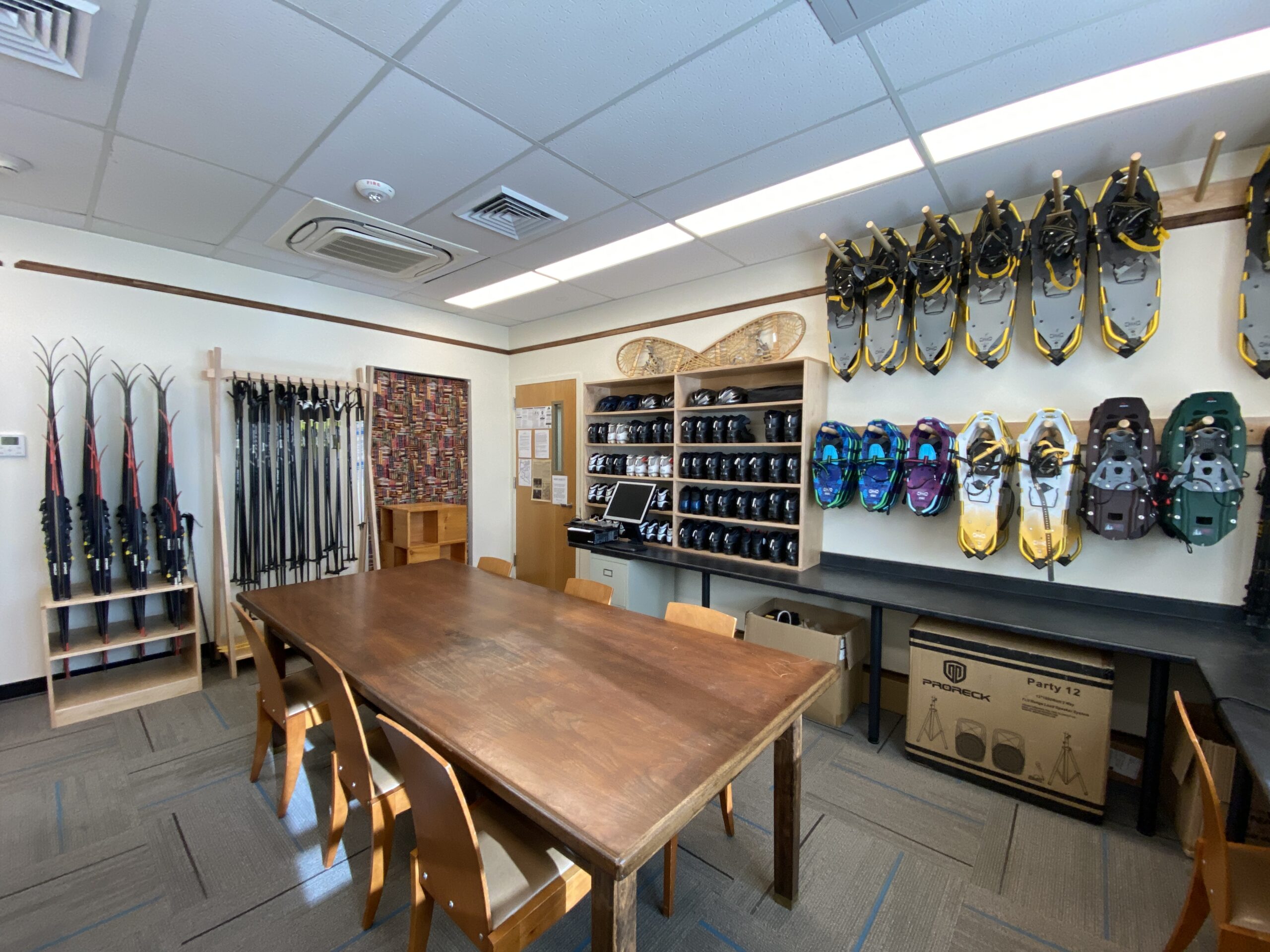 Shelves of outdoor gear bags and equipment