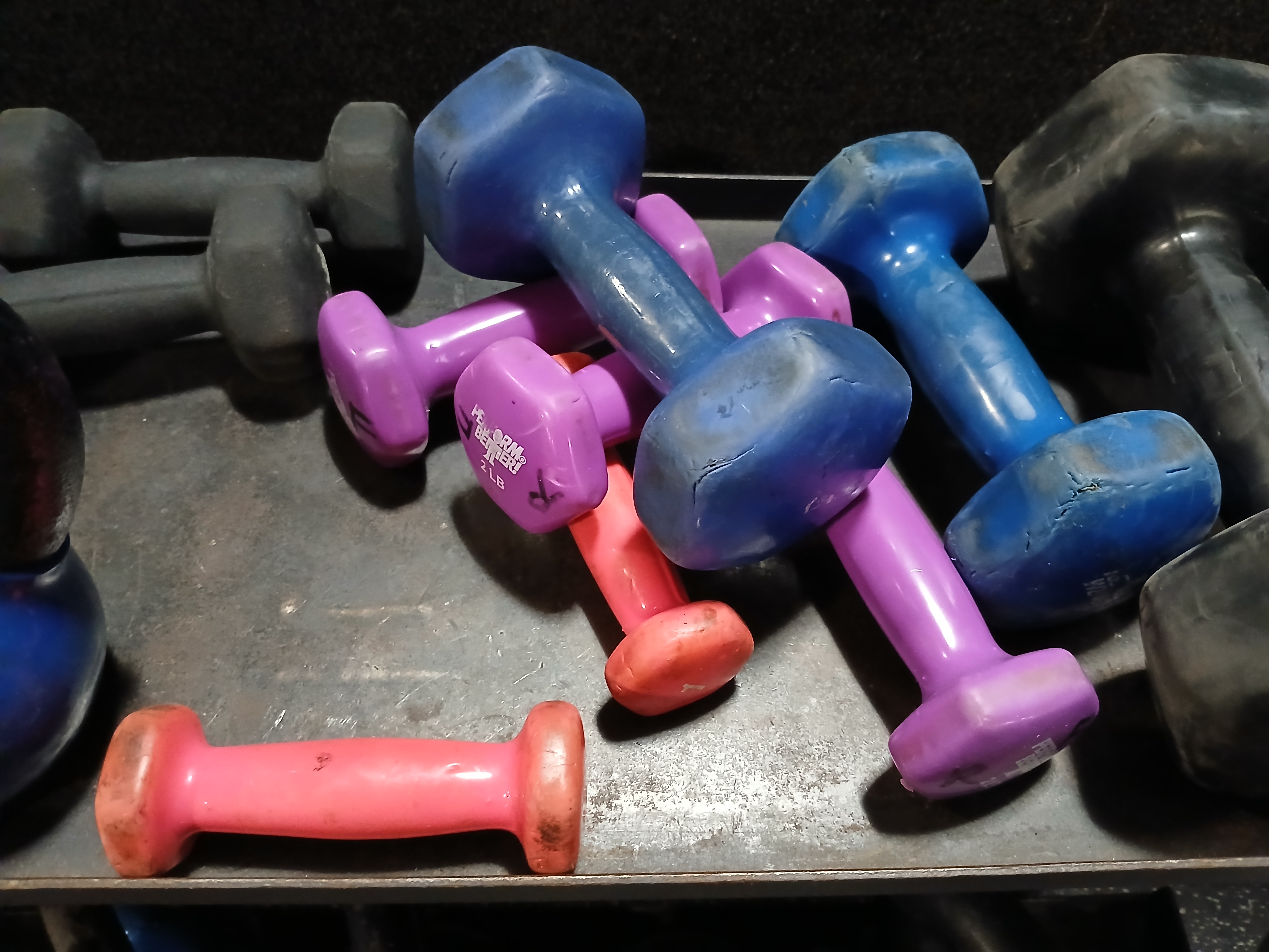 Colorful dumbbells in different sizes for home workouts