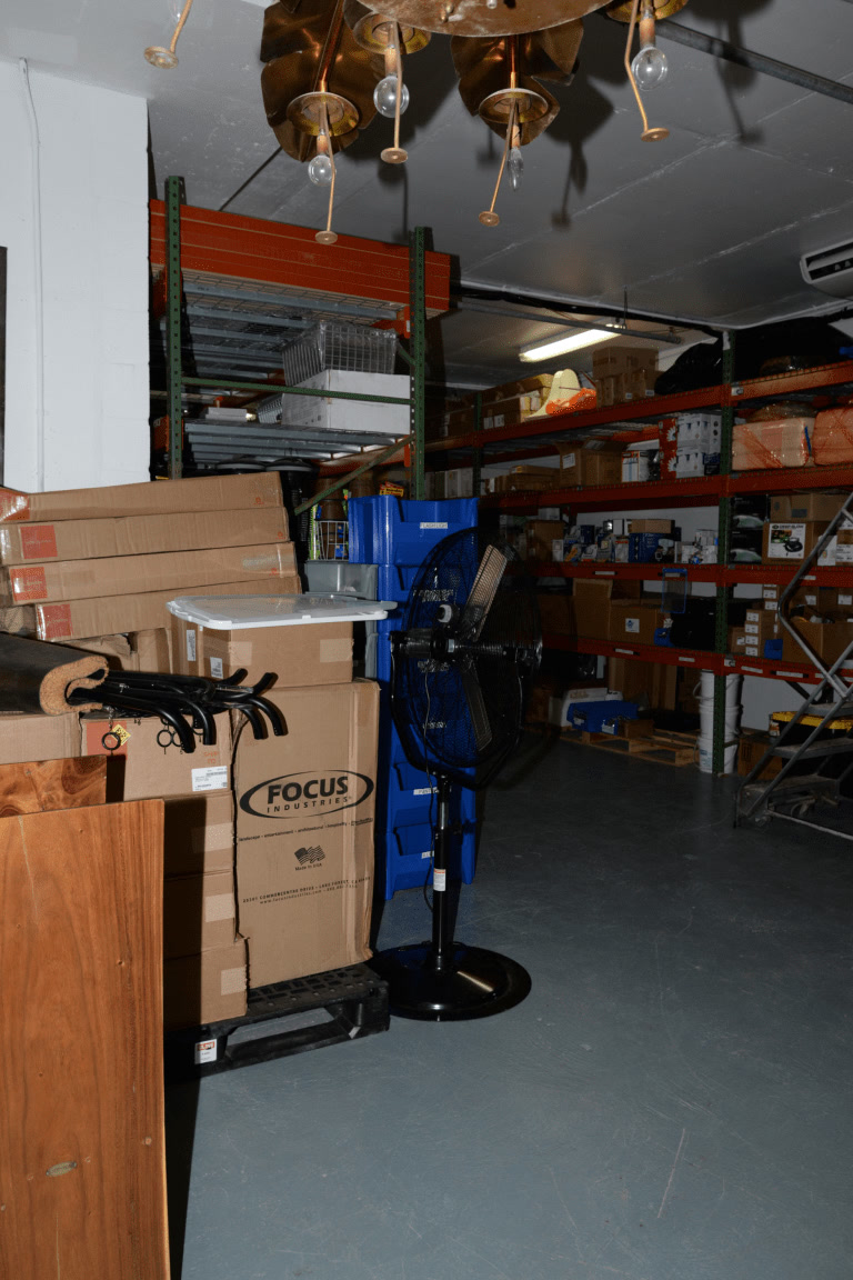 Warehouse shelves and stacked shipping boxes