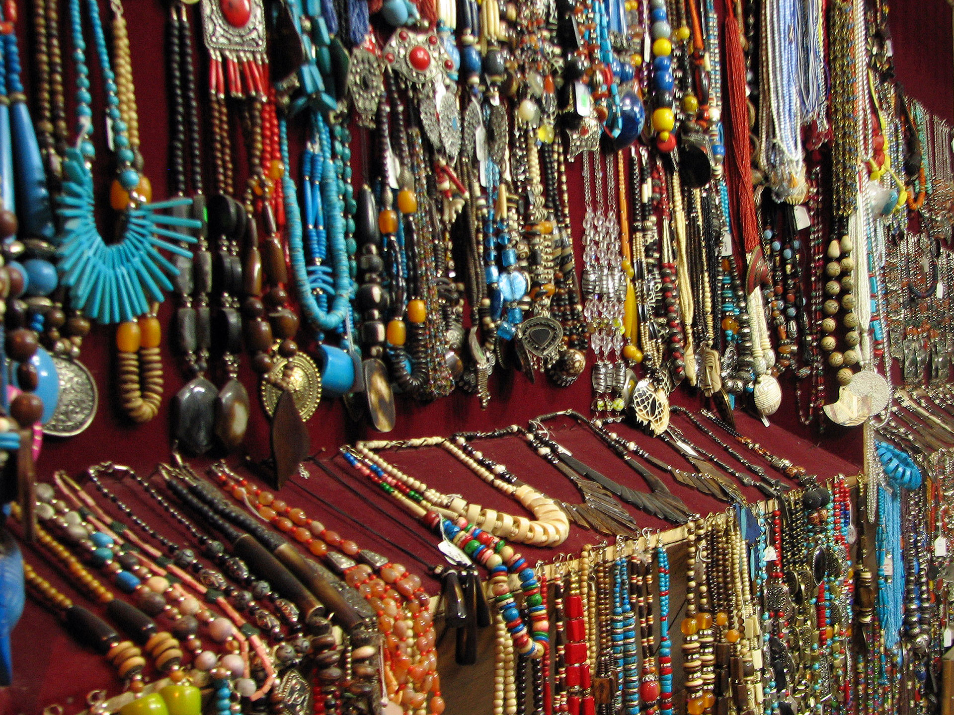 Assorted jewelry displayed for sale at a market stall