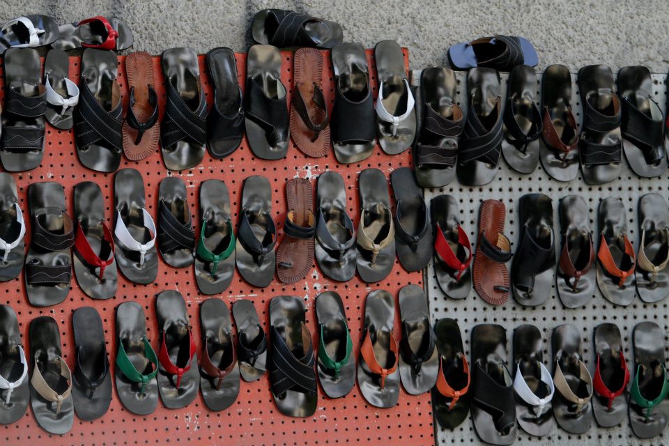Retail shoe shop with footwear displayed on shelves