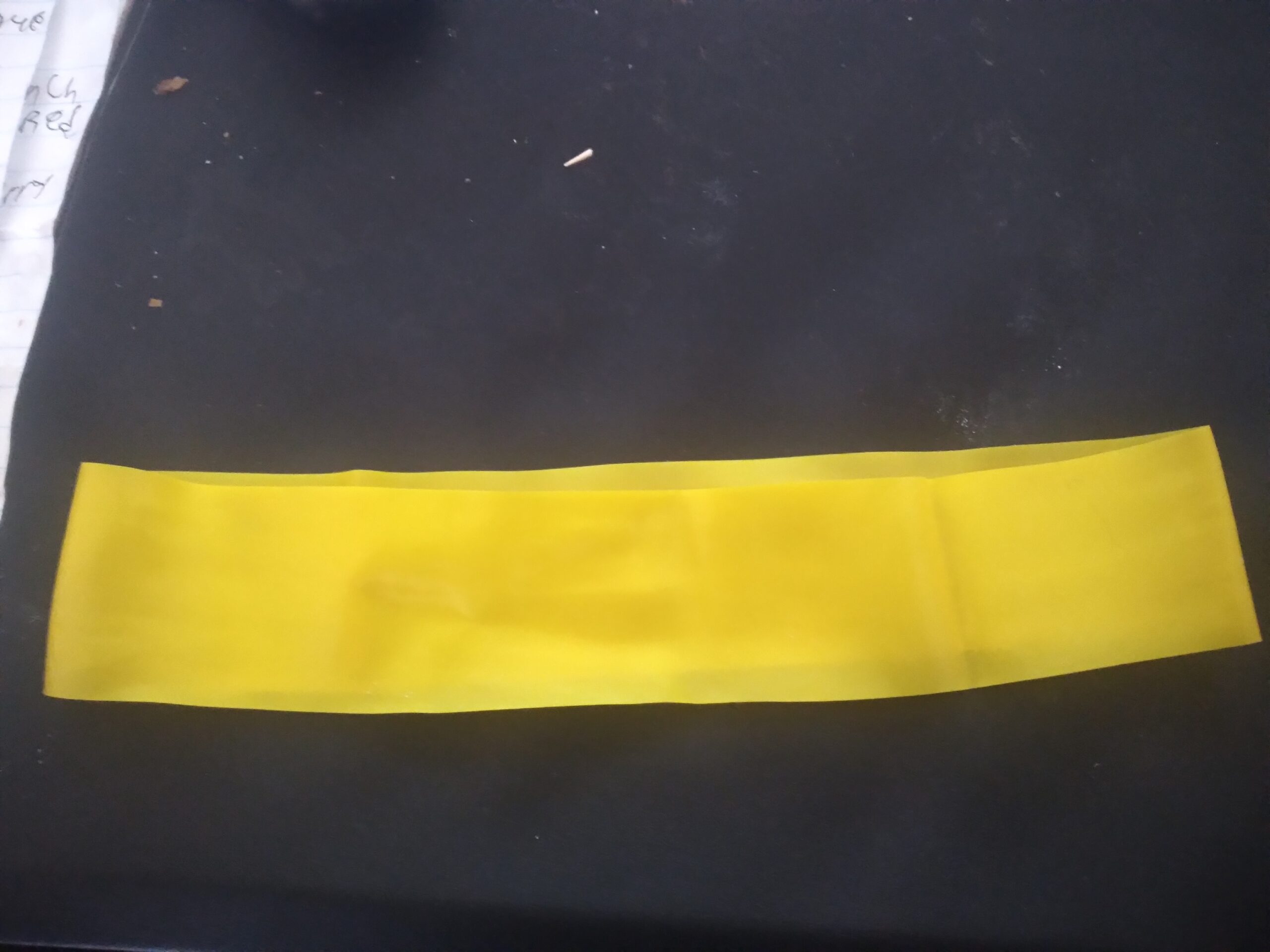 Resistance band fitness accessory on a plain background