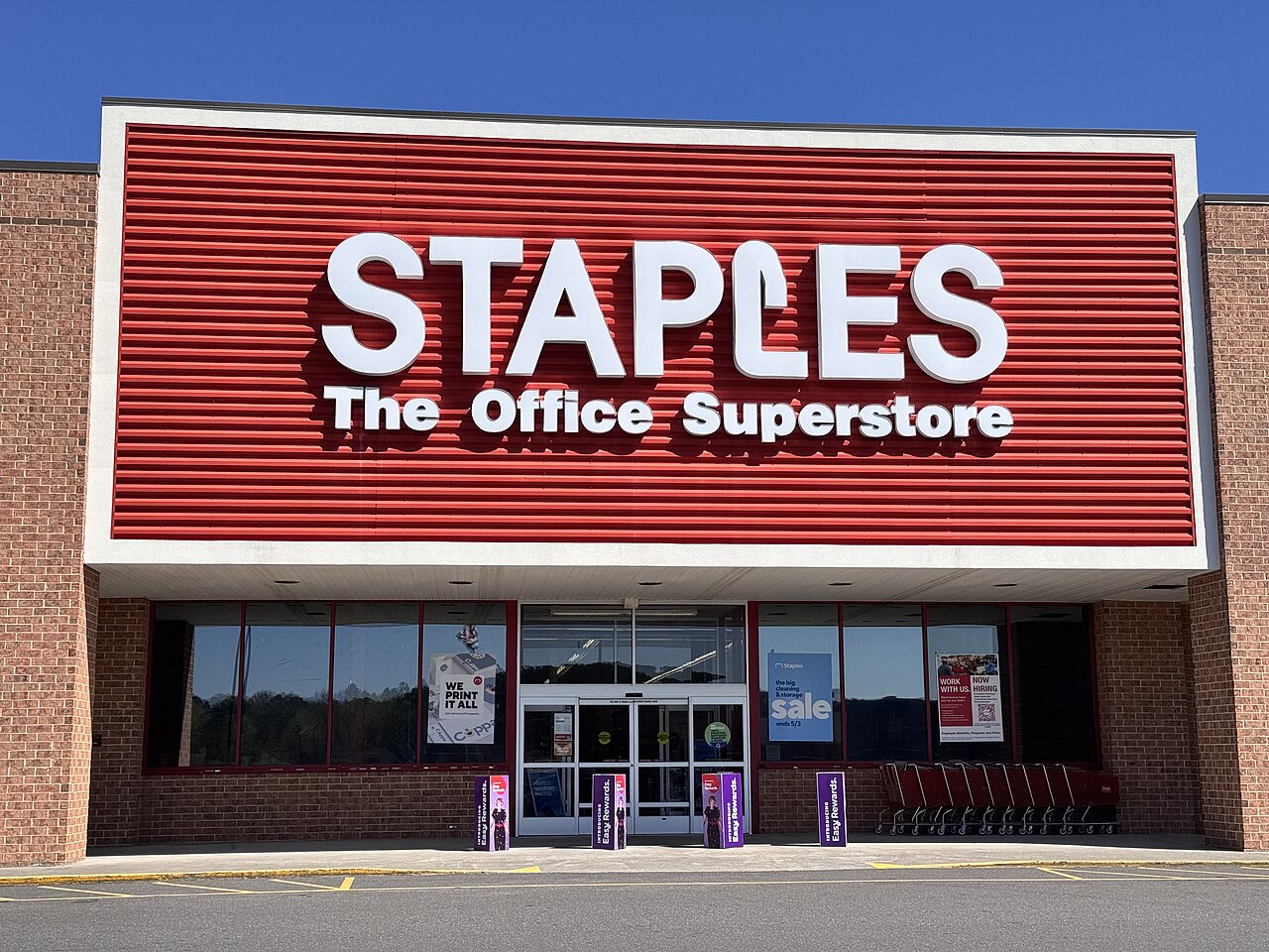 Office supplies superstore entrance with stationery and business-supply focus