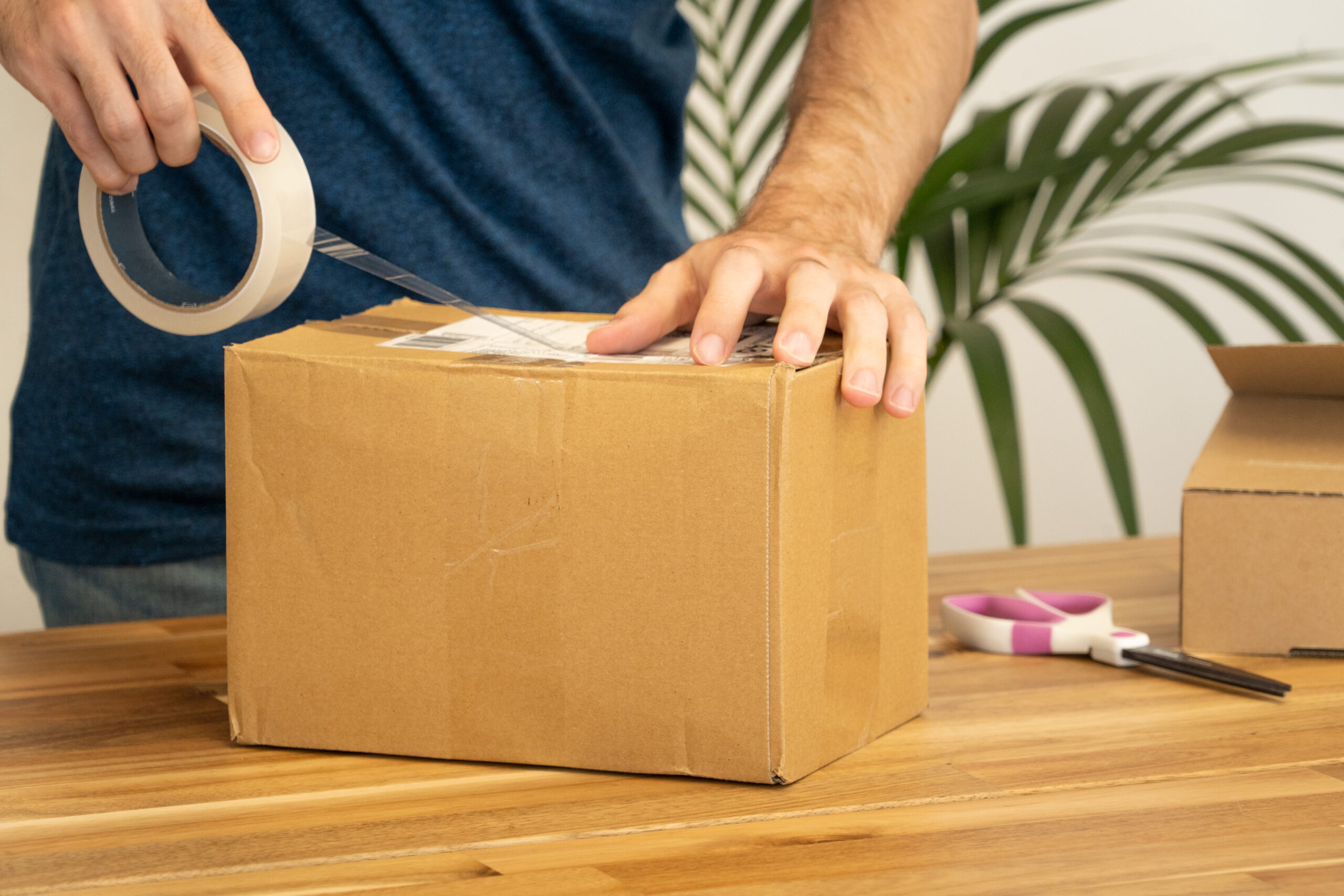 A shipping label being applied to a parcel before dispatch
