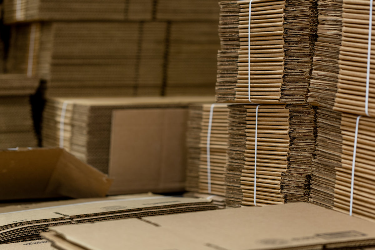 Flat cardboard shipping boxes used for packaging
