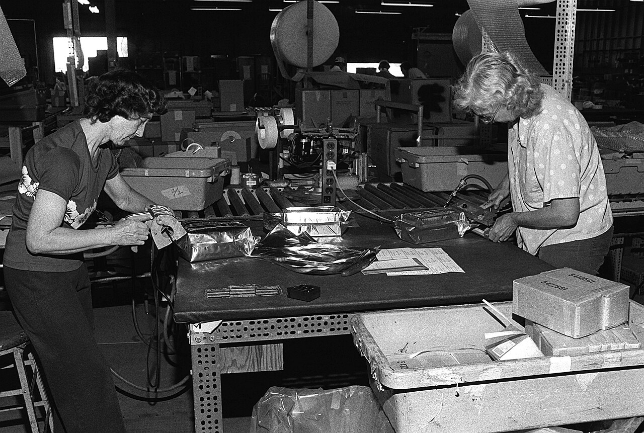 Warehouse workers preparing parcels for shipment