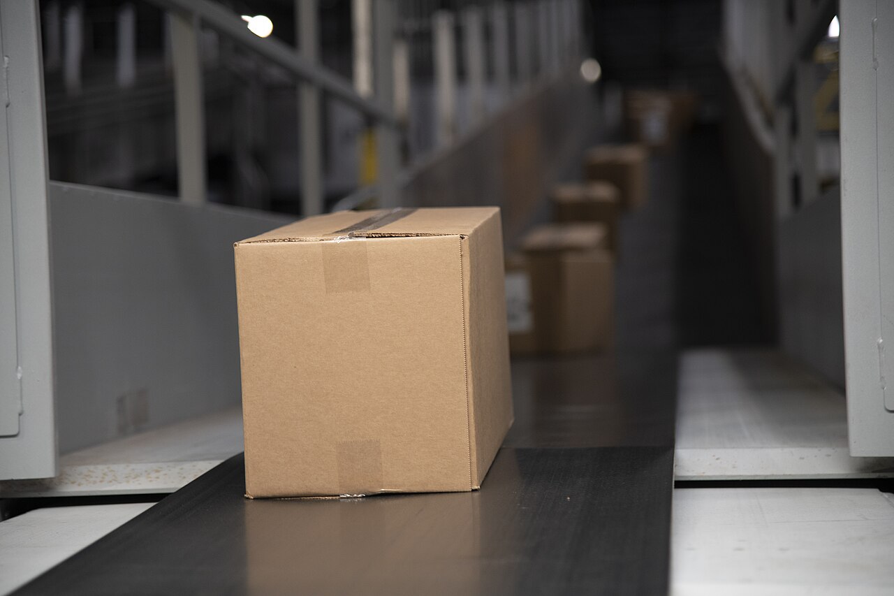 Packages moving through a parcel conveyor system