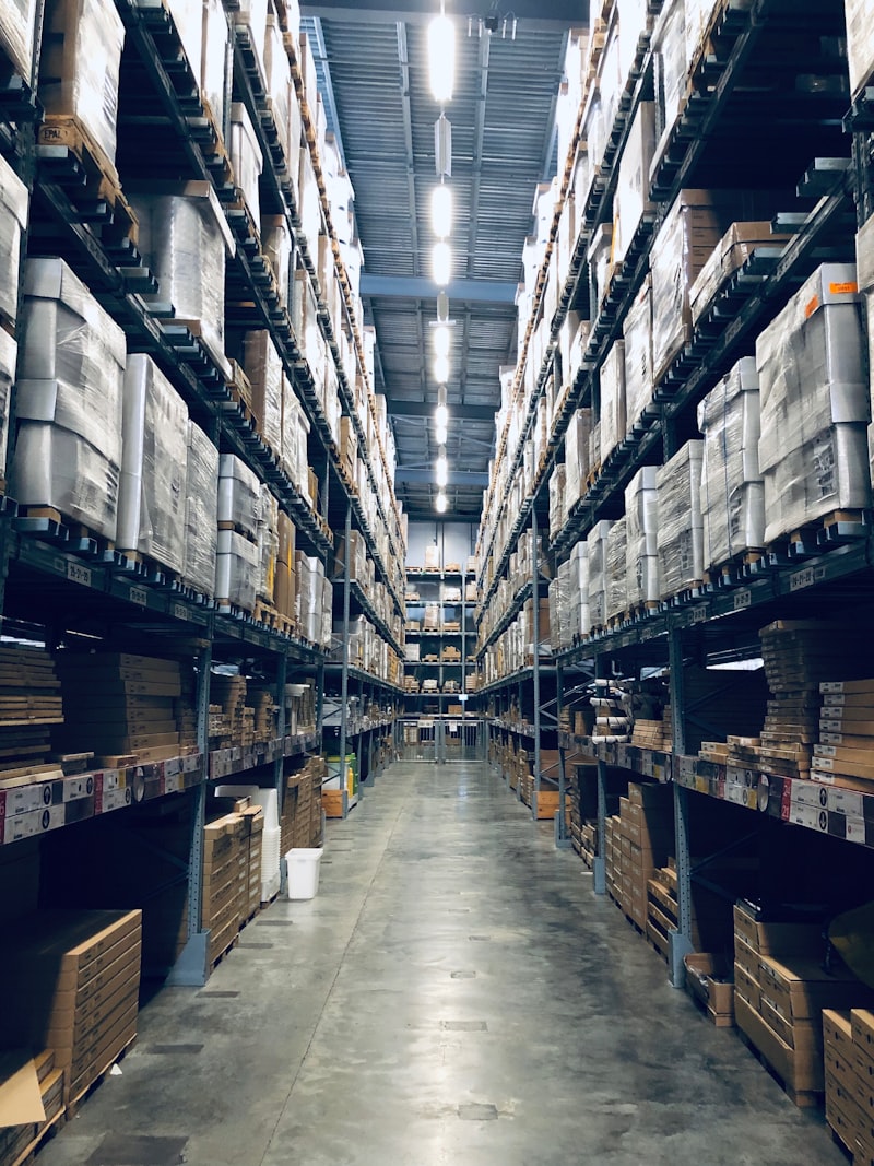 Warehouse staff sorting packages for consolidation