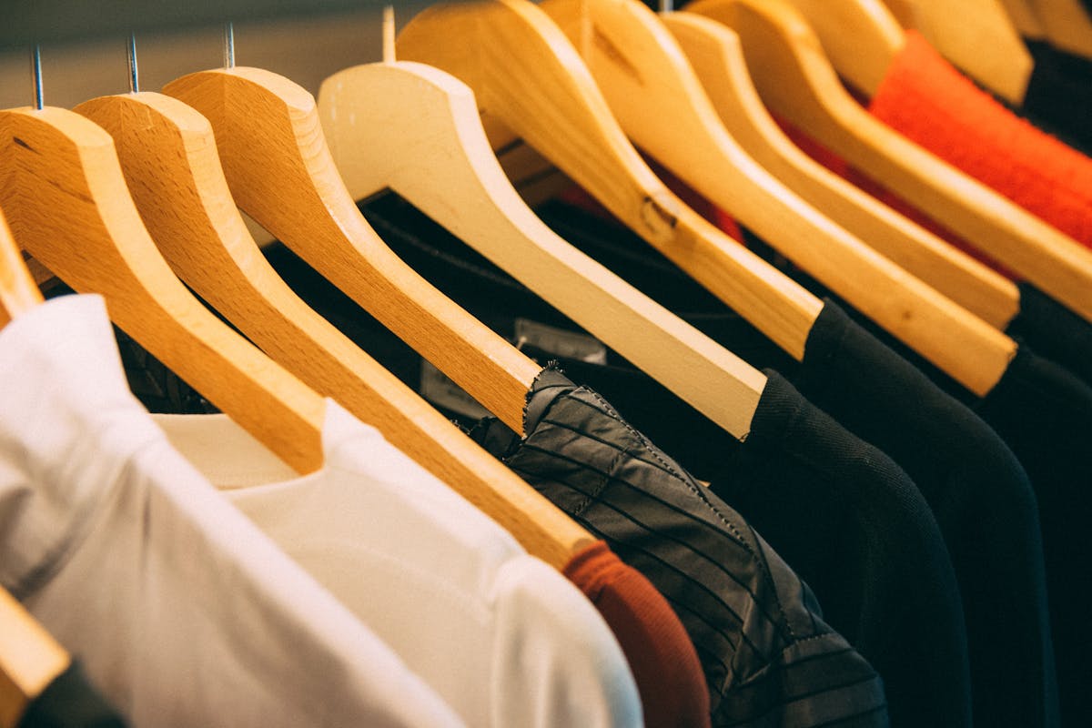 Fashion and clothing items photographed after arrival from a cross-border order, representing second-hand marketplace purchases